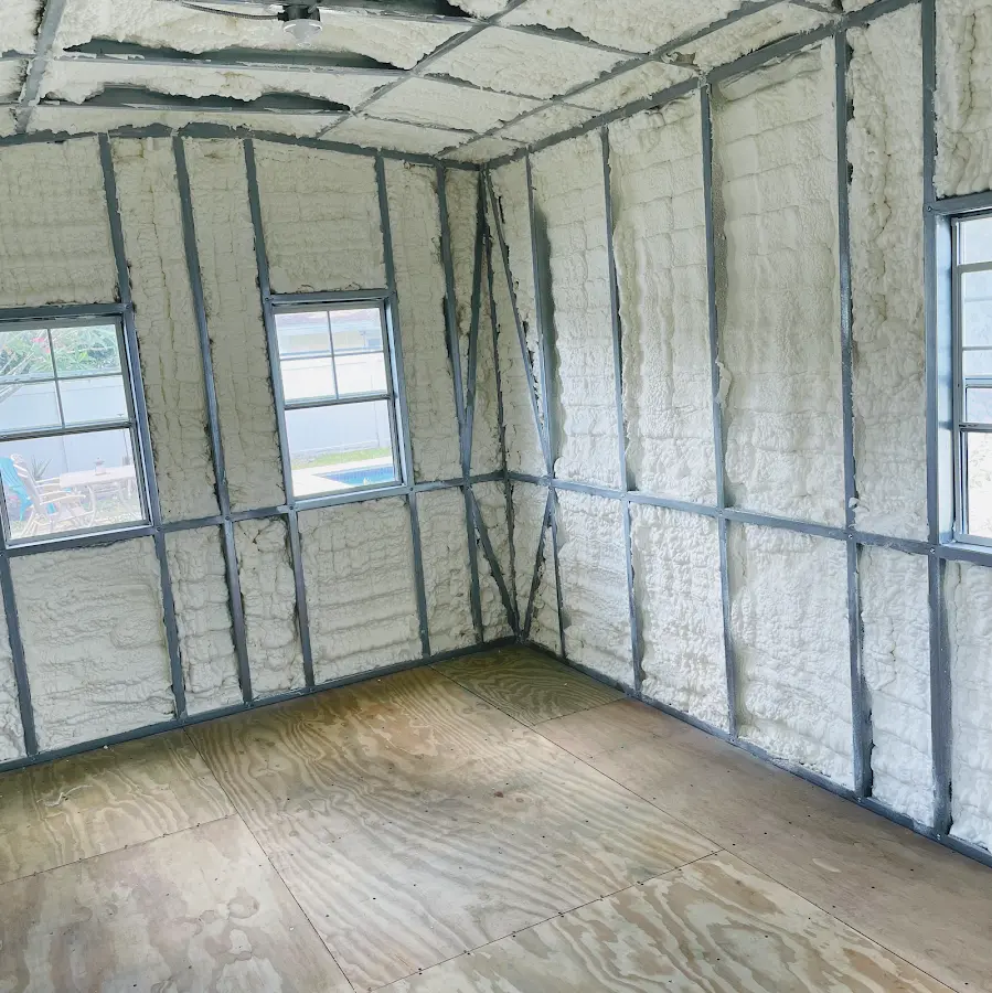 Closed-cell spray foam insulation applied to wall cavities in a residential project in Stewartville